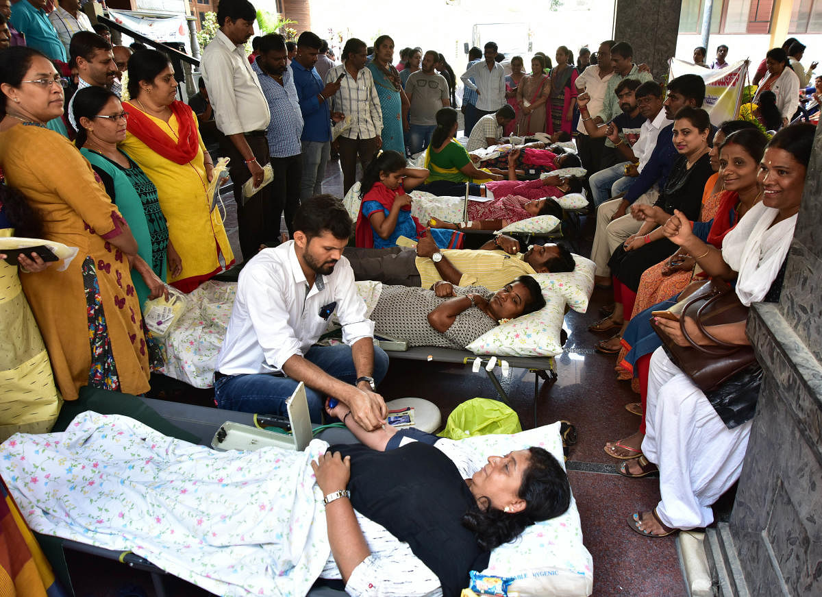 Protesting Vokkaligara Sangha employees donate blood at KIMS hospital on Tuesday. DH PHOTO/IRSHAD MAHAMMAD