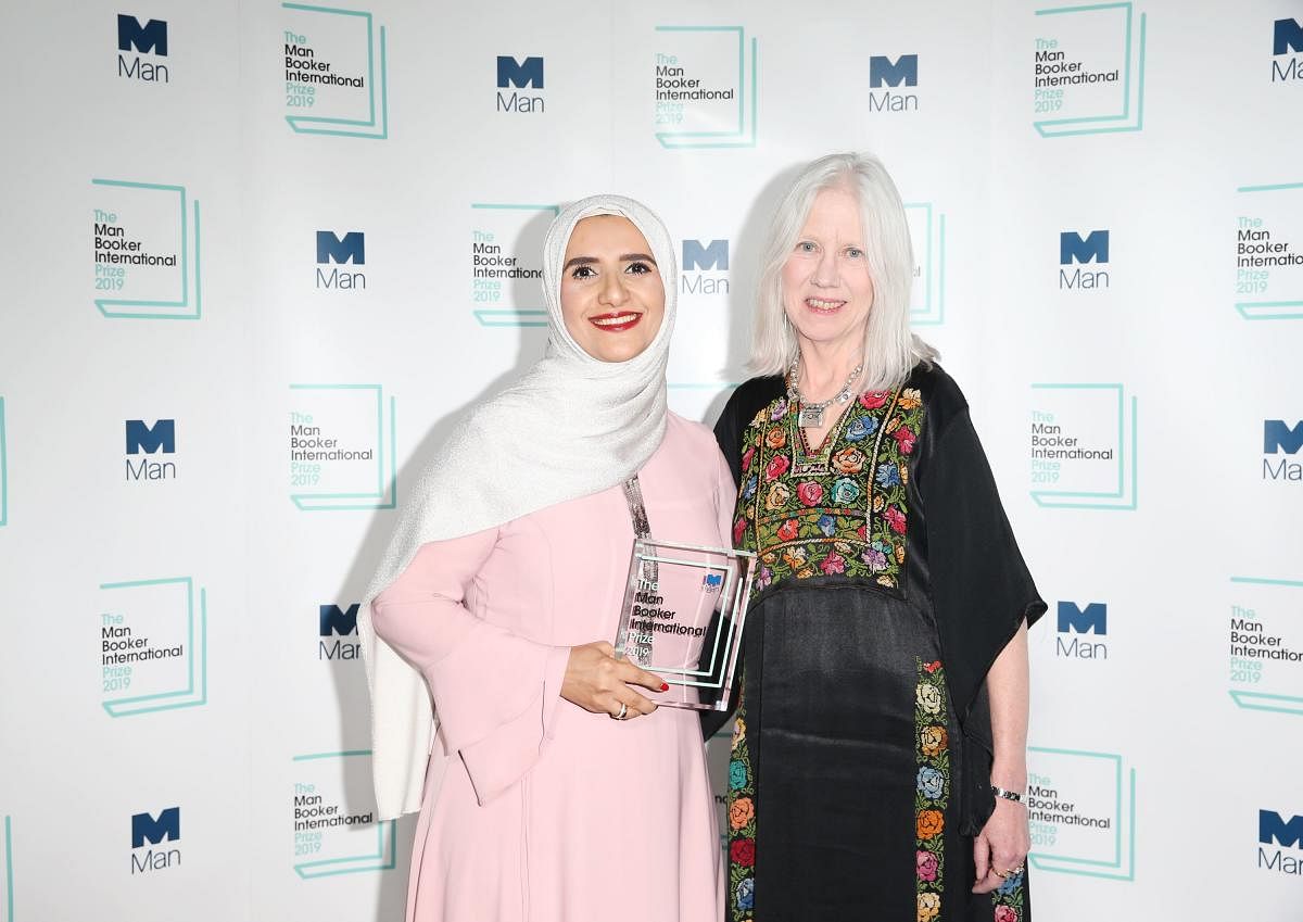 Arabic author Jokha Alharthi (L) and translator Marilyn Booth pose after winning the Man Booker International Prize for the book 'Celestial Bodies' in London on May 21, 2019. (AFP)