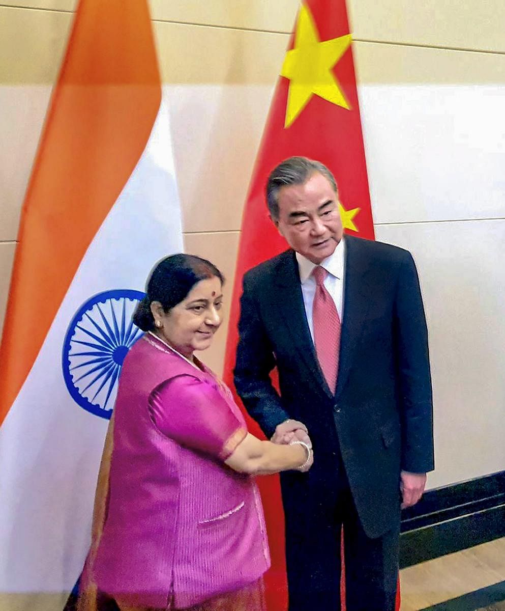 External Affairs Minister Sushma Swaraj meets Foreign Minister of China Wang Yi on the sidelines of the meeting of Shanghai Cooperation Organisation (SCO) Council of Foreign Ministers in Bishkek, Kyrgyzstan on Wednesday. PTI photo