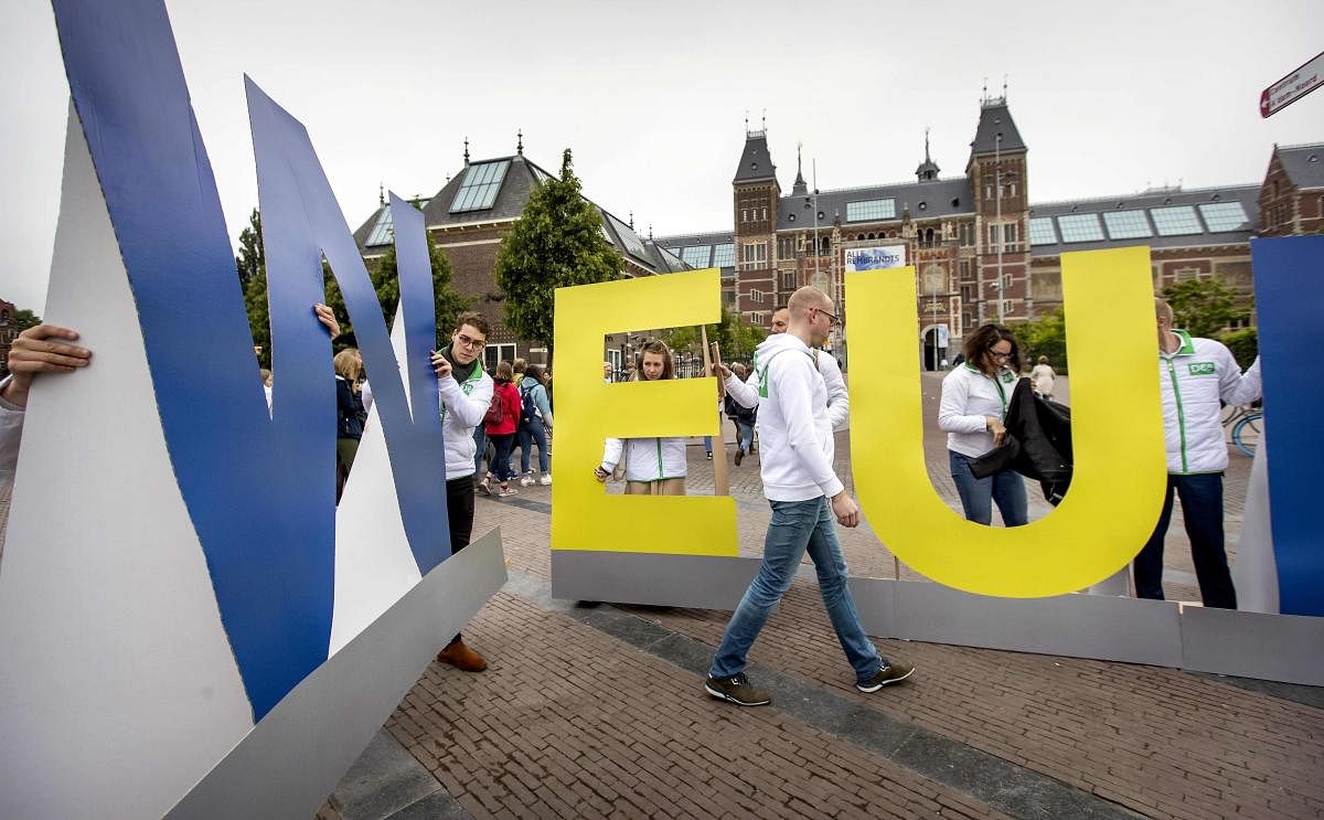 Members of the political party 'D66' place letters in front of the Museumplein to form the word "wEurope", the Netherlands. (Photo by AFP)