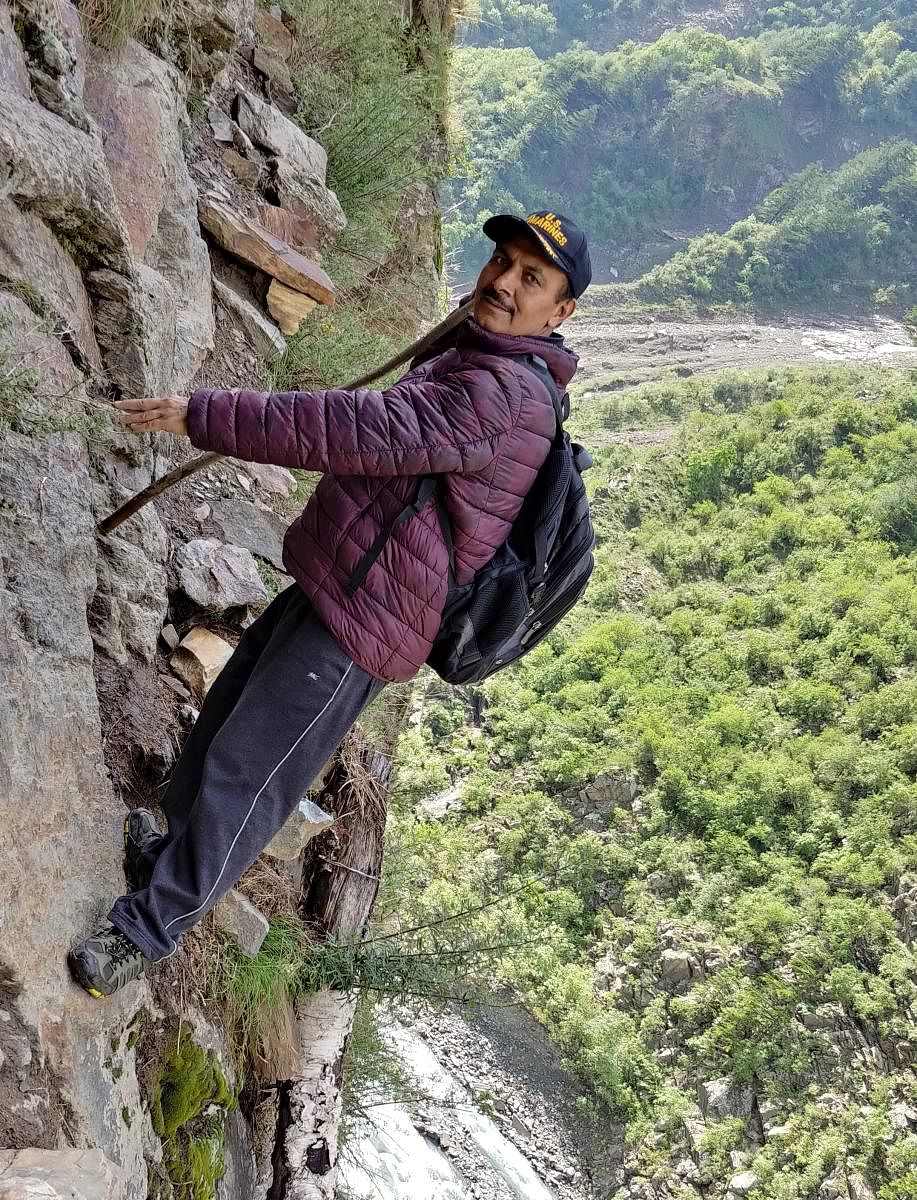 Surjit Saroch scaling the sheer cliff.