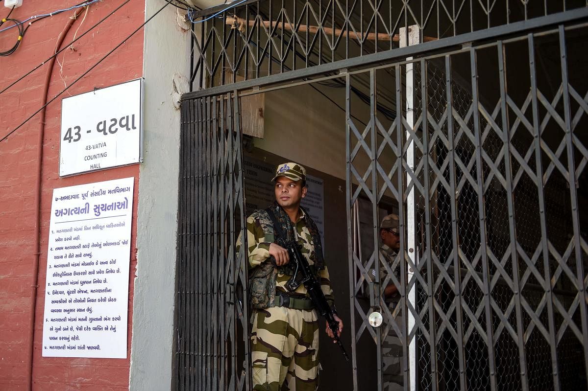An Indian paramilitary soldier from the Central Industrial Security Force (CISF) stands guard at a counting centre. (Photo AFP)