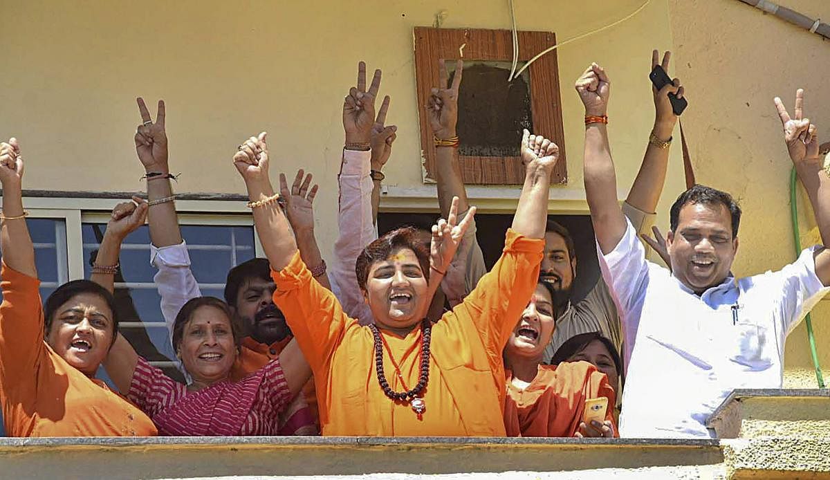 Pragya Singh Thakur along with the supporters celebrates her lead in the Lok Sabha elections 2019 as counting of votes is in progress, in Bhopal. PTI Photo