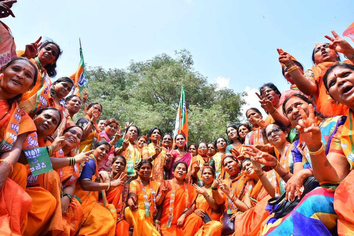 Women workers celebrate the victory of BJP candidate Pralhad Joshi in Dharwad on Thursday. DH Photo/Tajuddin Azad