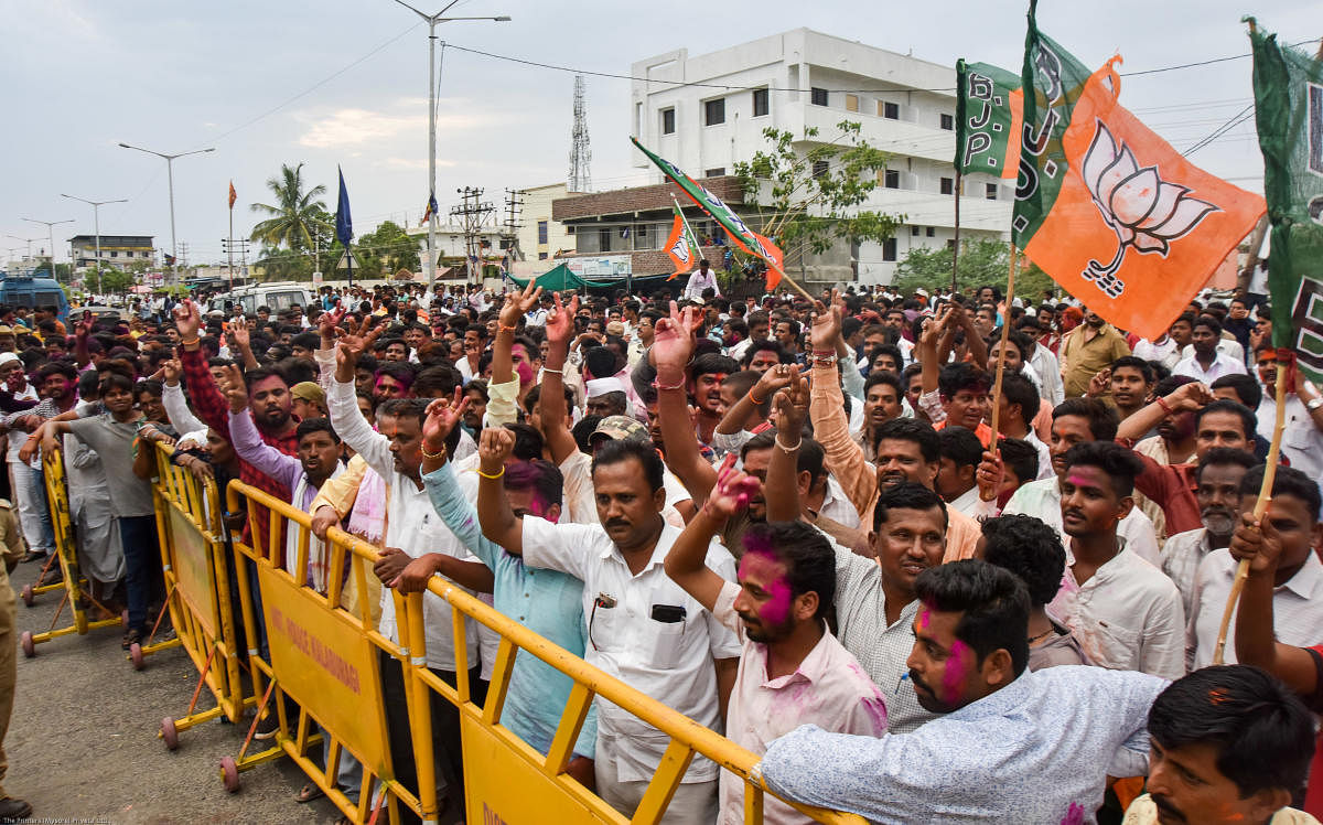 Supporters cheer for their leader Umesh Jadhav of BJP, who emerged victorious from Gulbarga Lok Sabha constituency, in Kalaburagi on Thursday. Prashanth H G