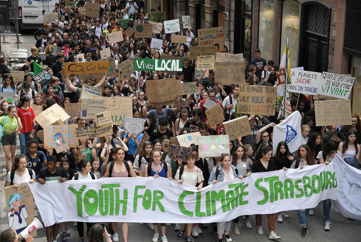 Youths take part in a protest demanding urgent action against global warming, on May 24, 2019, in Strasbourg, eastern France. (Photo by FREDERICK FLORIN / AFP)