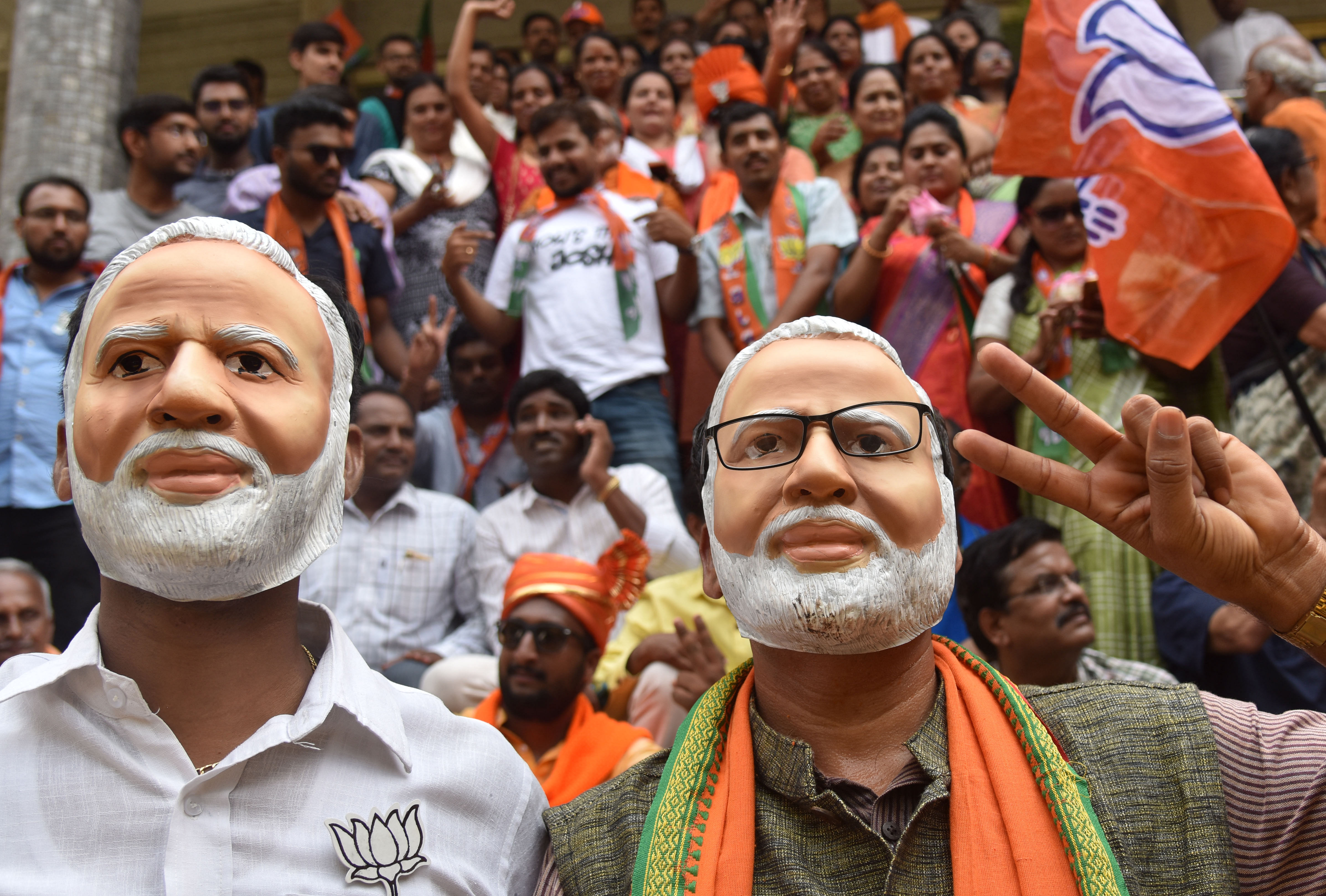 BJP party workers celebrating in front of State party office at Malleswara in Bengaluru on Thursday, 23 May, 2019. Photo by Janardhan B K