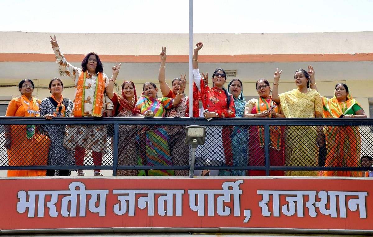 BJP party supporters celebrate party's lead during the counting of votes for Lok Sabha elections 2019, in Jaipur, Thursday, May 23, 2019. (PTI Photo)