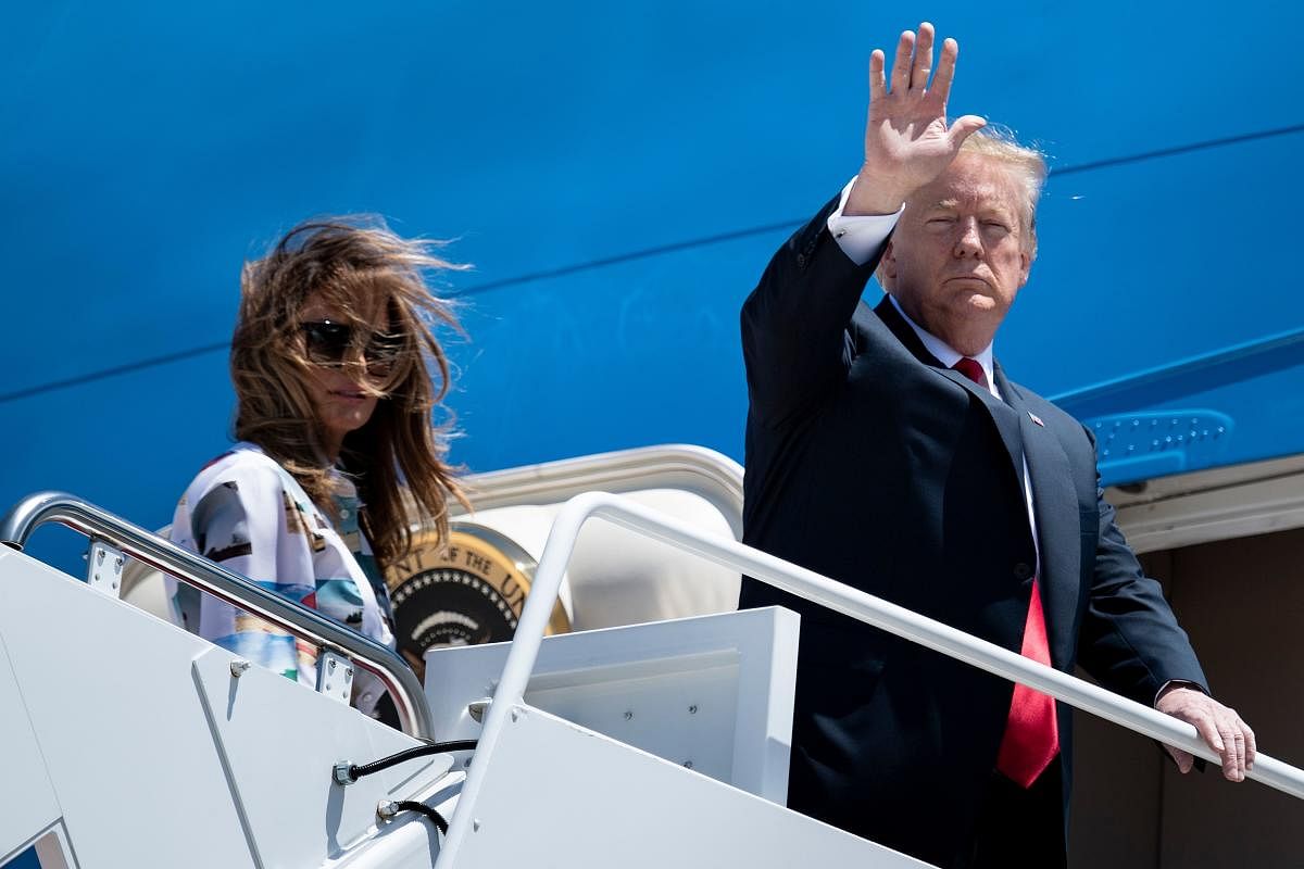 US President Donald Trump and First Lady Melania Trump board Air Force One at Joint Base Andrews in Maryland. The president is traveling to Japan for a three-day official visit. (Photo by AFP)