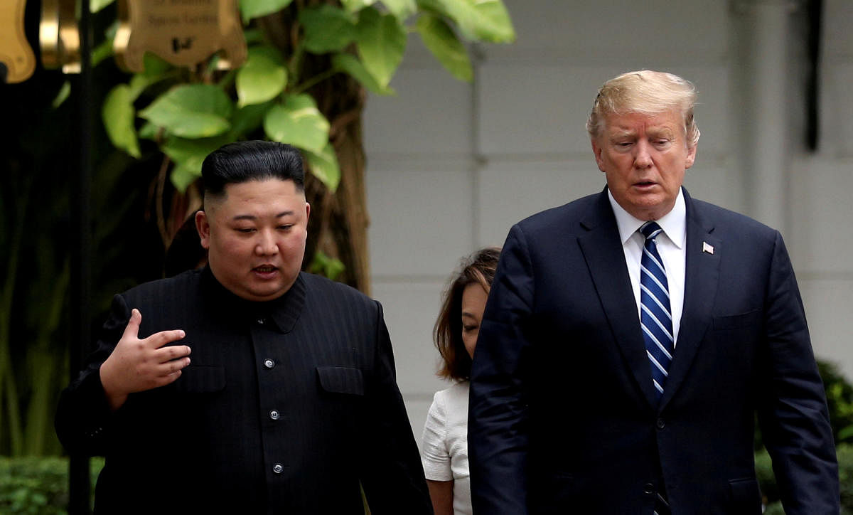 Kim Jong Un and Donald Trump talk in the garden of the Metropole hotel during the second North Korea-U.S. summit in Hanoi (REUTERS/Leah Millis/File Photo)