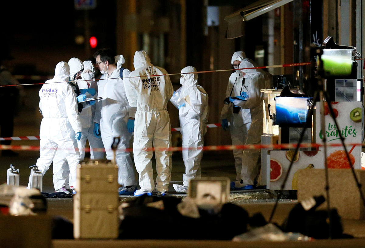 Forensic officers inspect the site of a suspected bomb attack in central Lyon. (Reuters Photo)