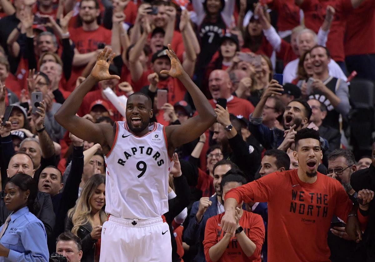 Toronto Raptors forward Serge Ibaka (9) and guard Danny Green (14, right) react in the final seconds as the Raptors advance to the NBA Finals after defeating Milwaukee Bucks in game six of the Eastern Conference final at Scotiabank Arena.  Credit: Dan Hamilton-USA TODAY Sports