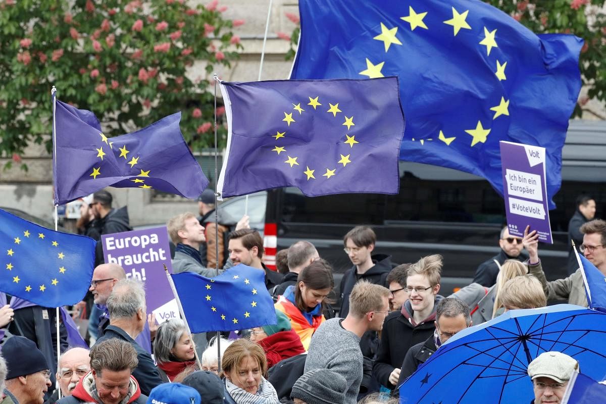 Protesters wave European flags during a rally organised by the "Pulse of Europe" pro-European movement on May 5, 2019 at Gendarmenmarkt square in Berlin. (Photo by Odd ANDERSEN / AFP)