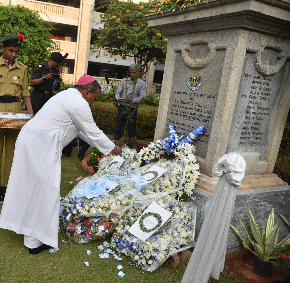 The Archbishop of Bangalore Peter Machado pays tribute at the war memorial at Old boy martyrs at St Joseph's Boys High School in Bengaluru on May 25, 2019. (DH PHOTO/JANARDHAN B K)