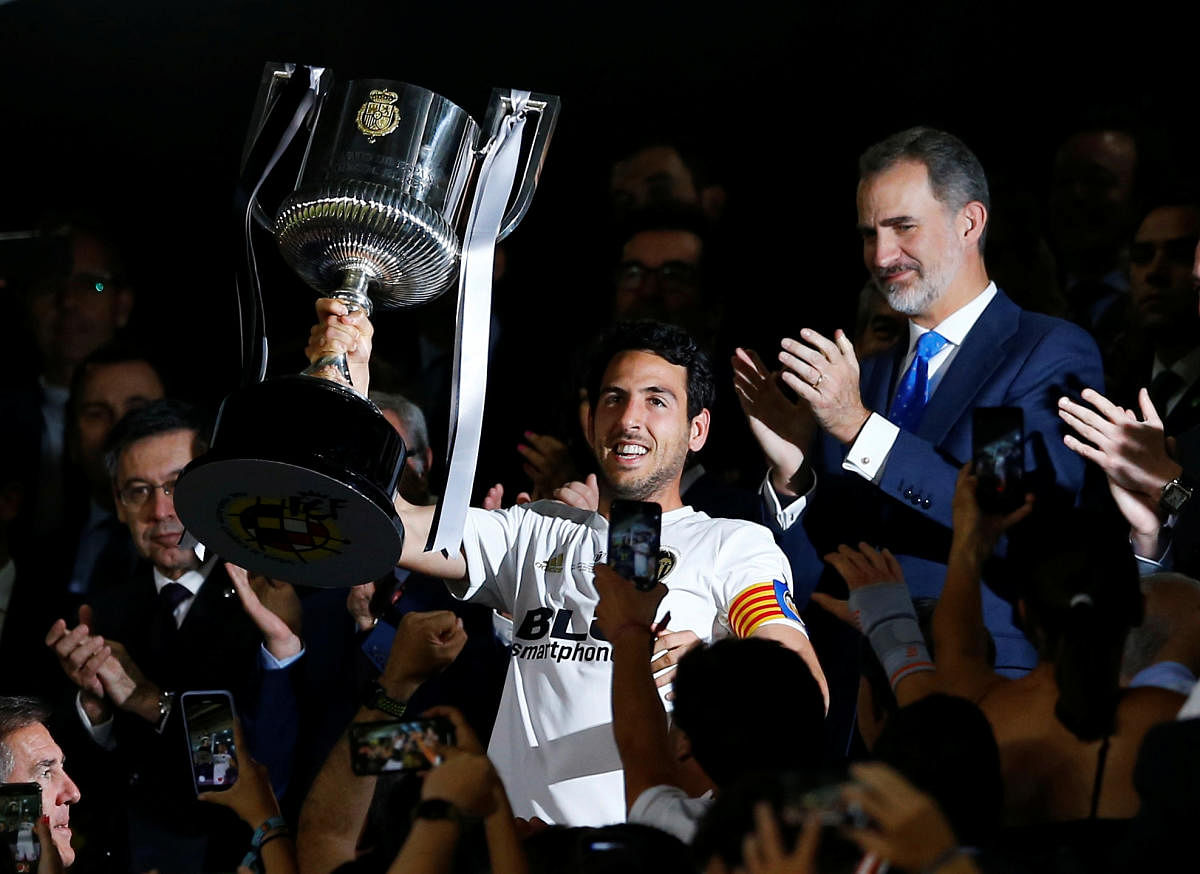 Valencia's Dani Parejo celebrates with the trophy after his side defeated Barcelona in a tense final. Credit: REUTERS/Marcelo del Pozo