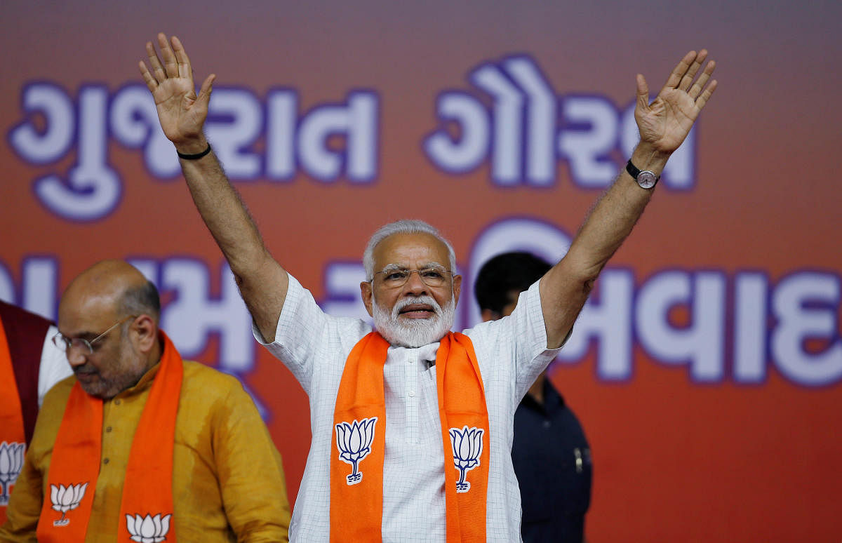 India's Prime Minister Narendra Modi gestures as he arrives to address his supporters at a public meeting in Ahmedabad, India, May 26, 2019. (REUTERS)