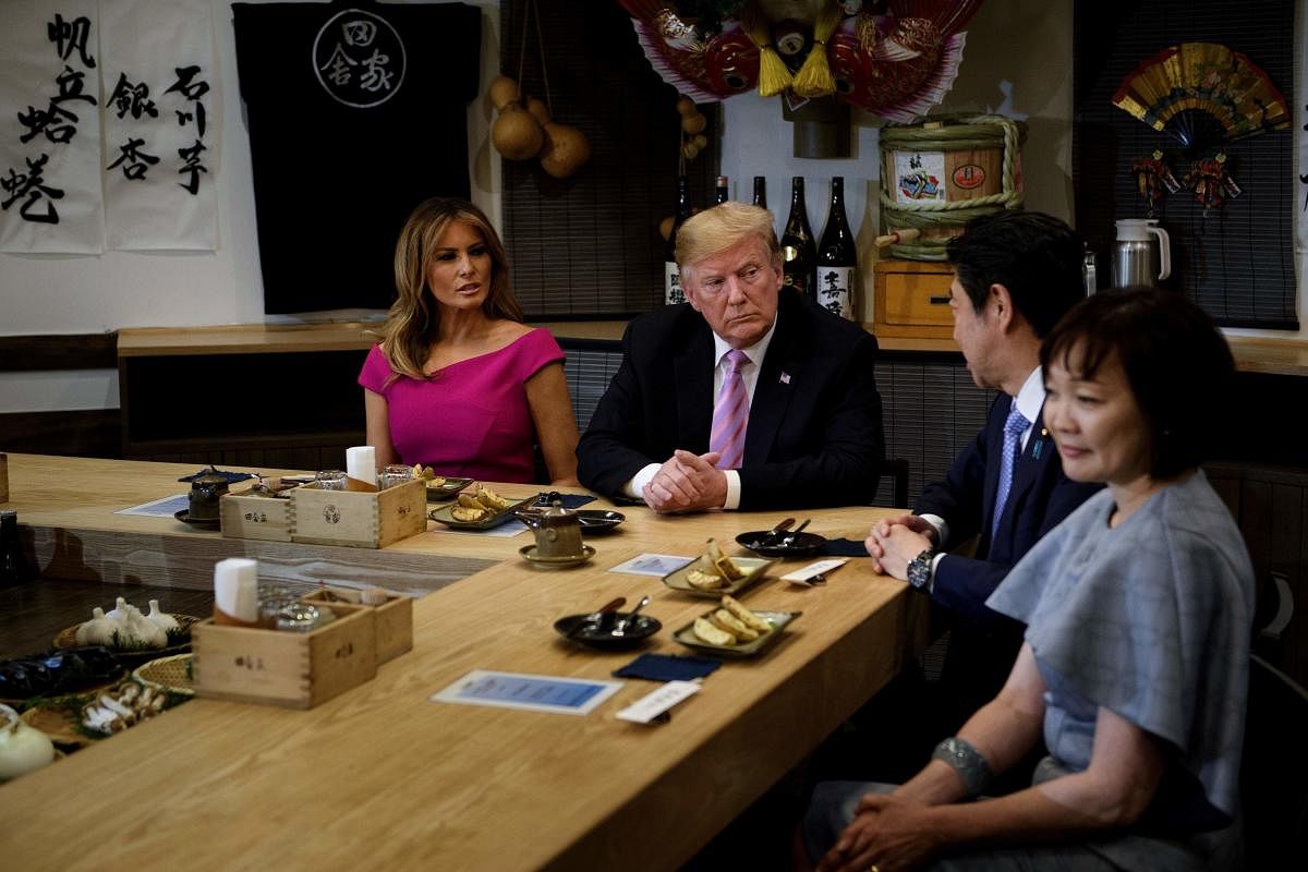 US President Donald Trump and First Lady Melania Trump join Japan's Prime Minister Shinzo Abe and his wife Akie Abe for dinner in Tokyo. (Photo by AFP)