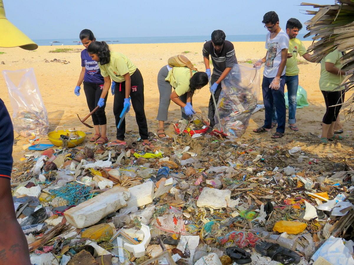 Volunteers clear garbage dumped on Tannirbavi beach in Mangaluru on Sunday. 