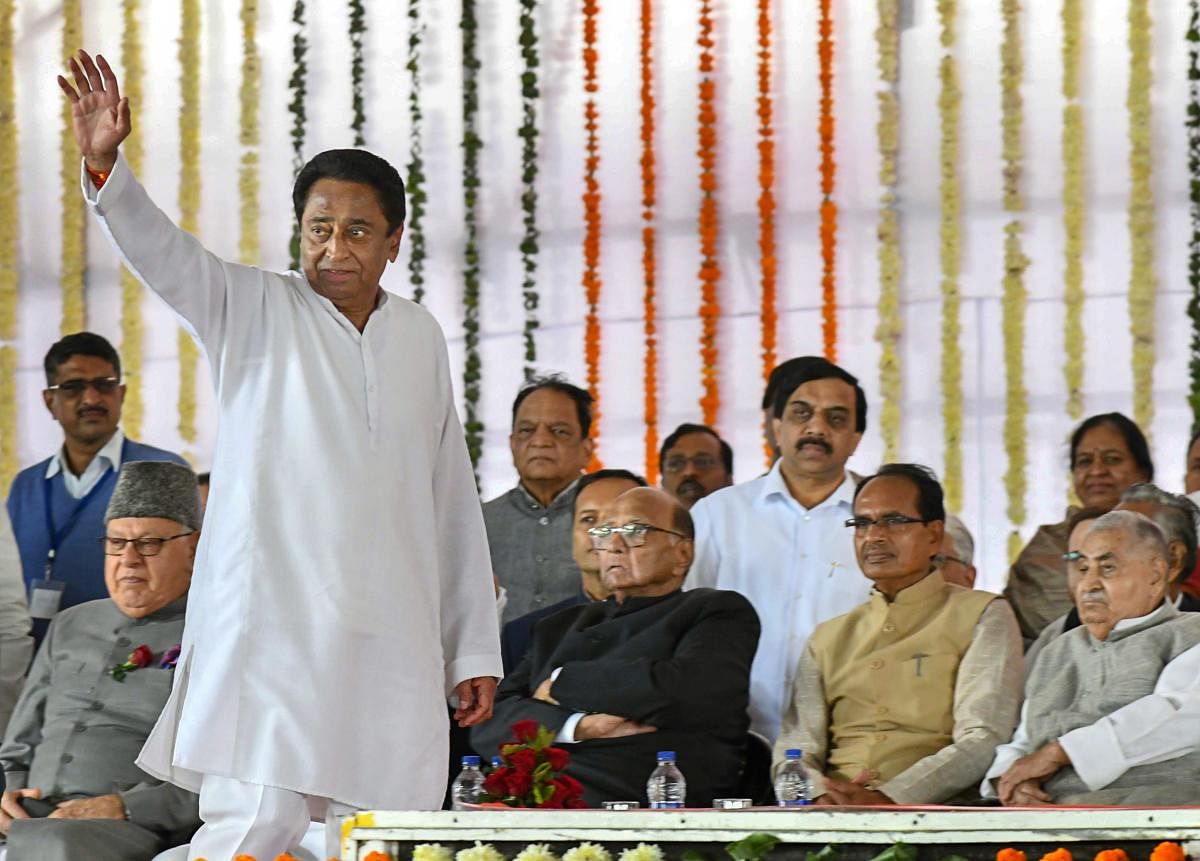 Bhopal: Newly-sworn in Madhya Pradesh Chief Minister Kamal Nath waves at the crowd during his swearing-in-ceremony, in Bhopal. (PTI File Photo)