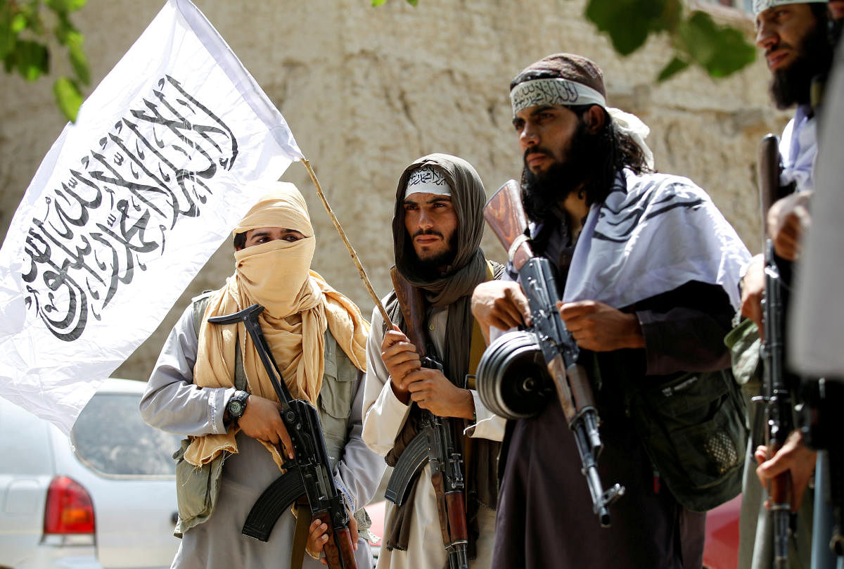 Taliban walk as they celebrate ceasefire in Ghanikhel district of Nangarhar province, Afghanistan last year. (REUTERS/Parwiz/File Photo)