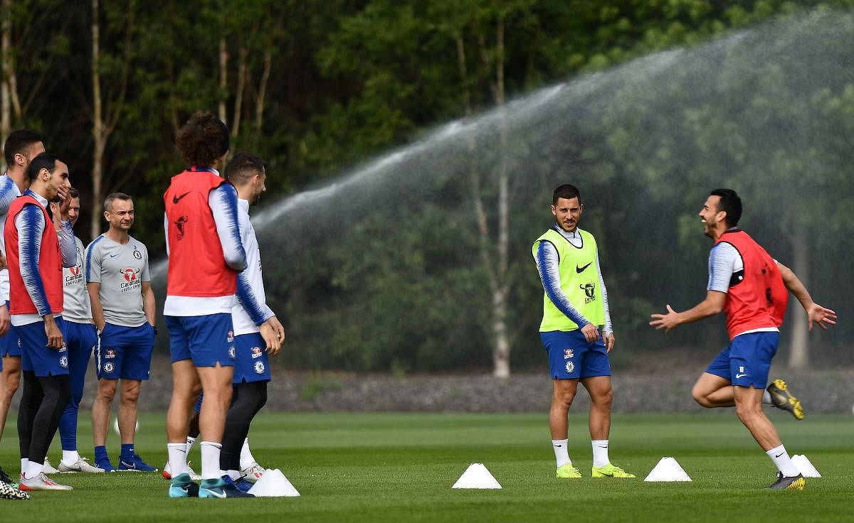 Chelsea's Belgian midfielder Eden Hazard (2R) and Chelsea's Spanish midfielder Pedro (R) attend a training session at Chelsea Training Ground, in Cobham, Surrey on May 22, 2019, ahead of their Europa League final football match against Arsenal. (Photo AFP