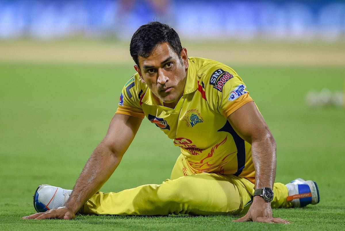 CSK skipper MS Dhoni stretches at the commence of the Indian Premier League 2019 (IPL T20) cricket match between Chennai Super Kings (CSK) and Sunrisers Hyderabad (SH), at MAC Stadium in Chennai, Tuesday, April 23, 2019. (PTI Photo)