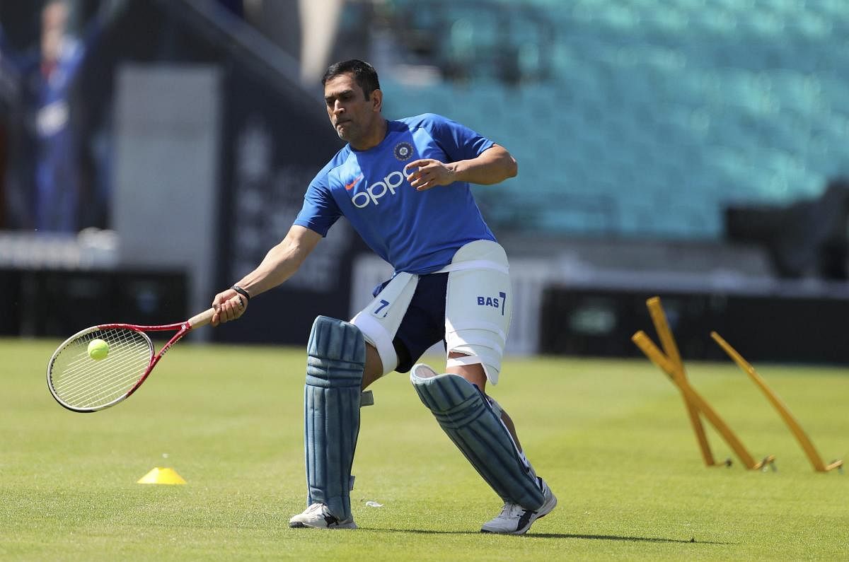 MS Dhoni indulges in a game of tennis during India's practice session at the Oval. AP/ PTI