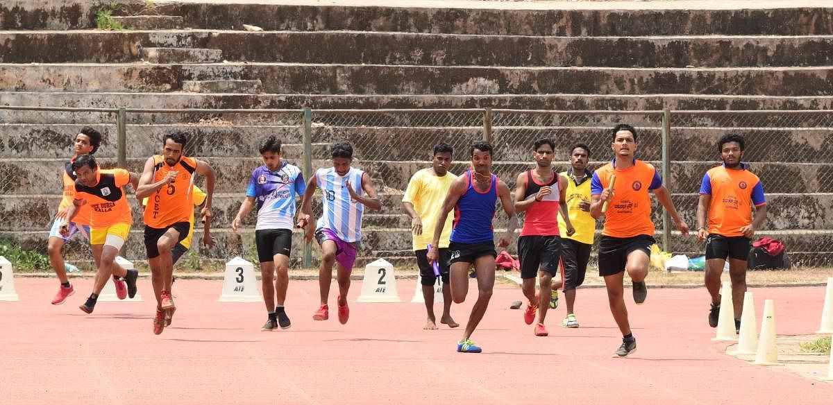 Yakshagana artistes take part in the ‘Yakshadhruva Sports Meet 2019’ held at Mangala Stadium in Mangaluru on Tuesday.