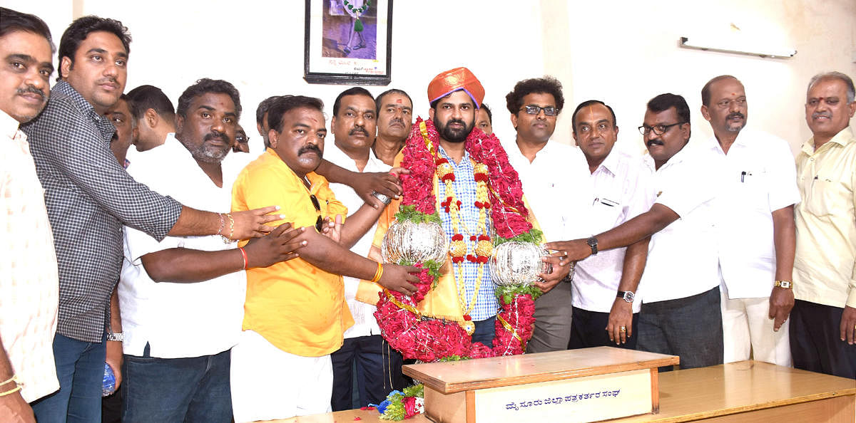 BJP workers felicitate MP Prathap Simha on his re-election in Mysuru, on Tuesday. BJP state secretary M Rajendra, city (district) president Dr B H Manjunath and Srivathsa are seen.