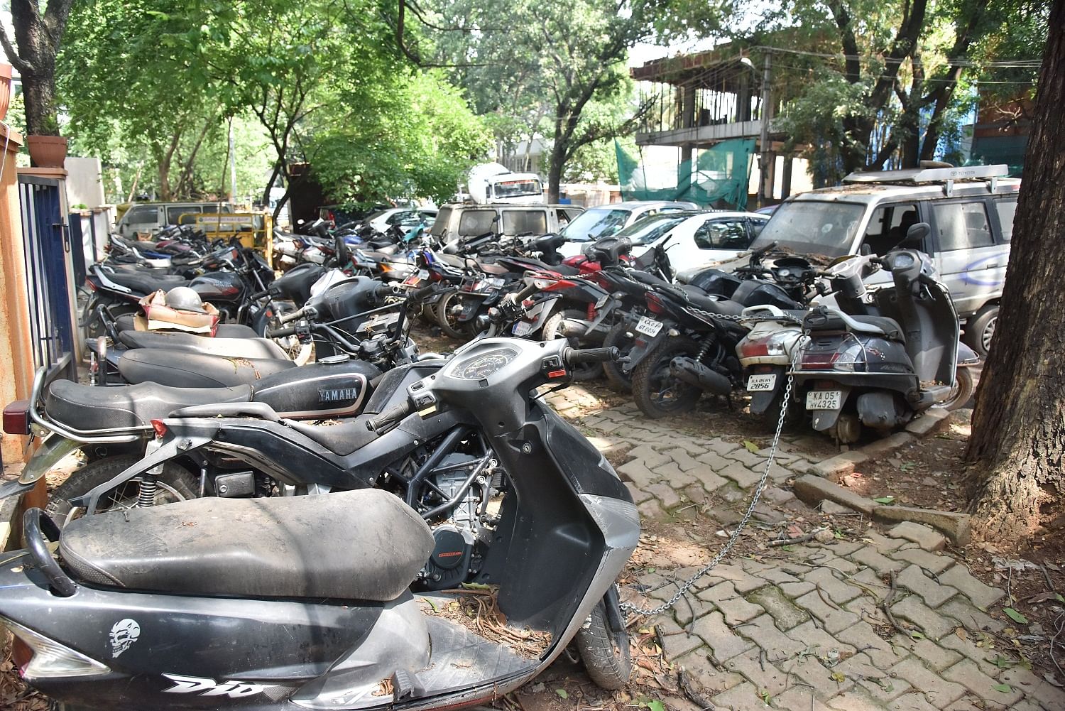 A large number of seized vehicles occupy footpaths near the Jayanagar police station, obstructing pedestrian movement. DH PHOTO BY B K JANARDHAN