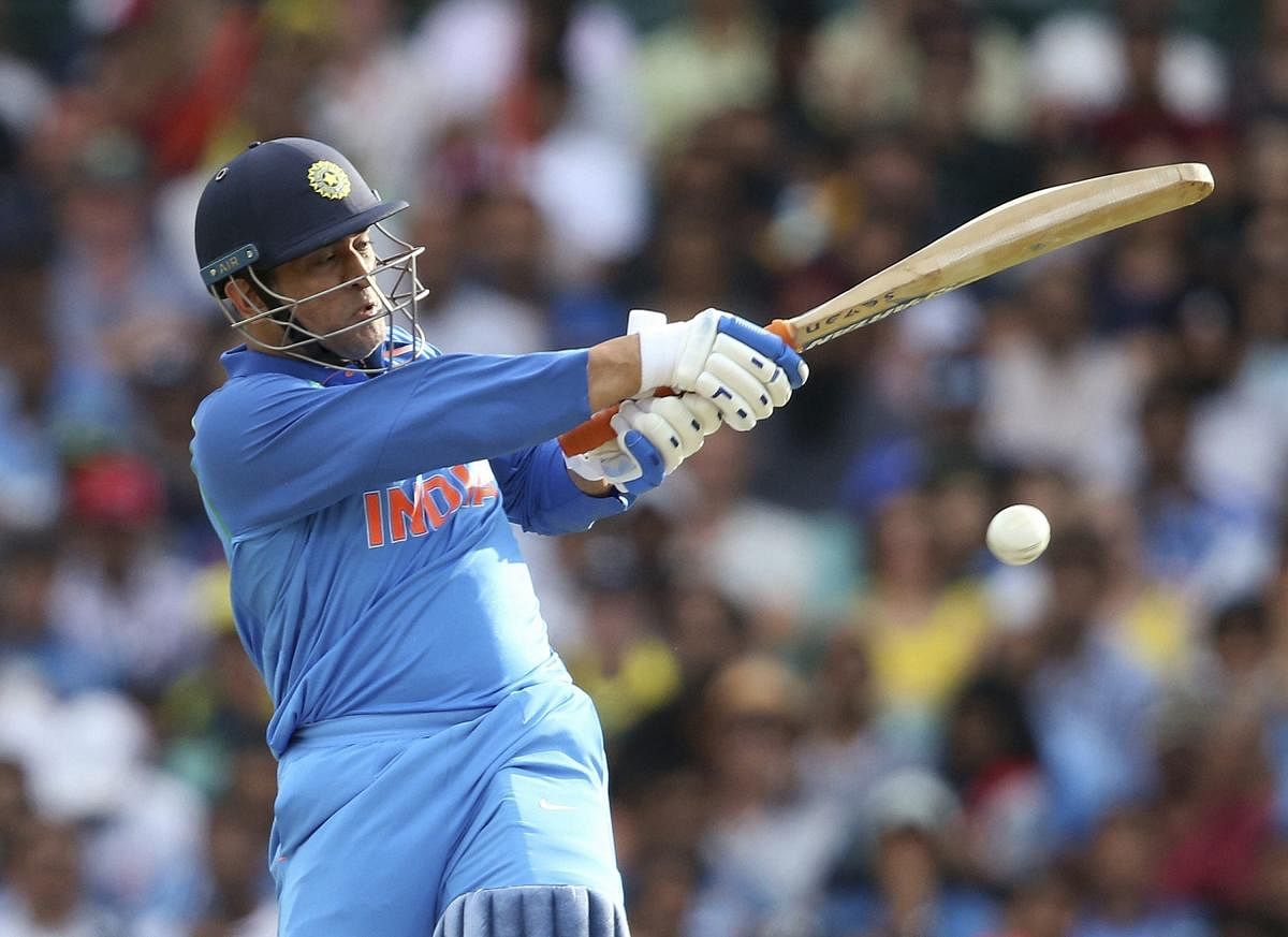 India's M.S. Dhoni drives the ball against Australia during their one day international cricket match in Sydney. (PTI File Photo)