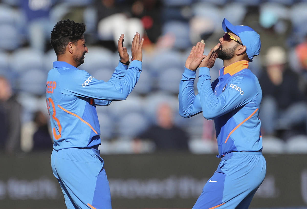 Kuldeep Yadav (left) bagged three wickets in India's 95-run win over Bangladesh in a World Cup warm-up tie. AP/PTI 