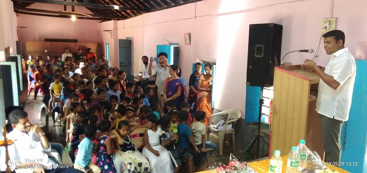 MLA Harish Poonja speaks at the Prarambhotsava at Kookrabettu School.