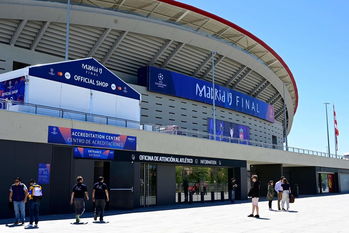People walk outside the Wanda Metropolitan Stadium in Madrid on May 29, 2019 ahead of the UEFA Champions League final football match between Liverpool and Tottenham Hotspur on June 1. (AFP Photo)