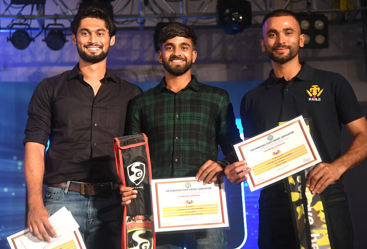 PROUD MOMENT: (From left) Ronit More, R Samarth and K V Siddharth were honoured by the KSCA for their brilliant performances in the 2018-19 domestic season. DH PHOTO
