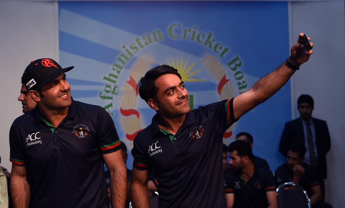 Afghan national team cricketers Rashid Khan (R) and Mohammed Nabi (Photo AFP)