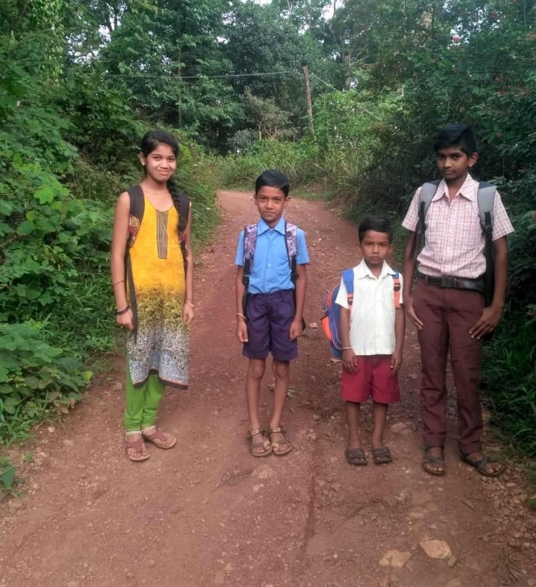 Owing to bad roads, schoolchildren from Mujekanu village in Kalasa taluk are compelled to walk to the schools.