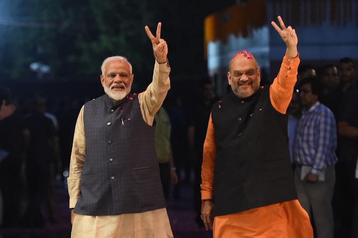 With Amit Shah taking oath as a Cabinet minister in the second term of Modi-led Union government, he is set to get an important portfolio and will have to resign from the party president post. AFP File photo