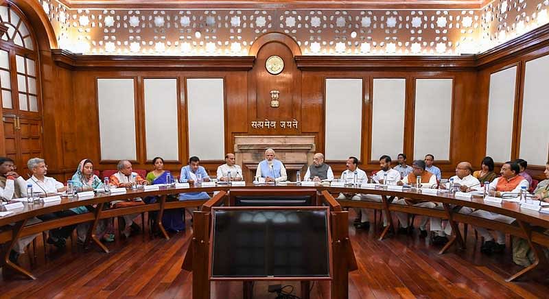 Prime Minister Narendra Modi with Union Ministers Nitin Gadkari, Rajnath Singh, Amit Shah, Nirmala Sitharaman and others during the first cabinet meeting, at the Prime Minister’s Office, in South Block, New Delhi. (PTI Photo)