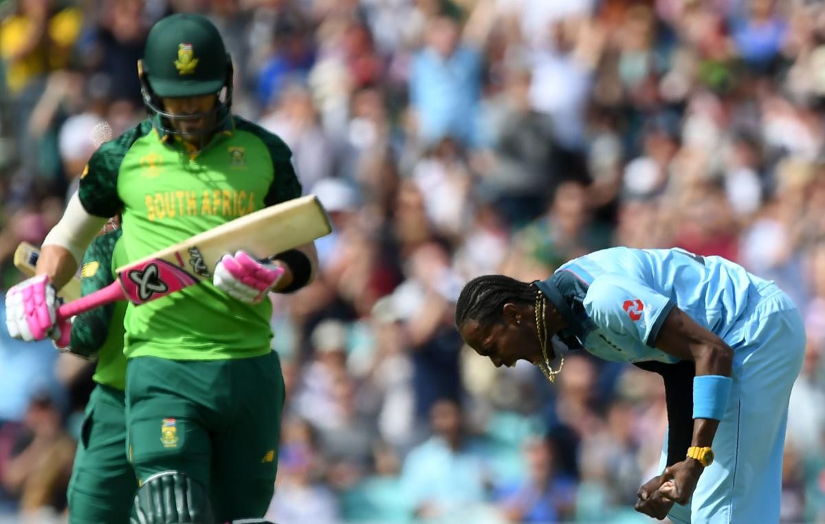 England's Jofra Archer (R) celebrates after the dismissal of South Africa's captain Faf du Plessis (L) during the 2019 Cricket World Cup group stage match between England and South Africa at The Oval in London on May 30, 2019. AFP