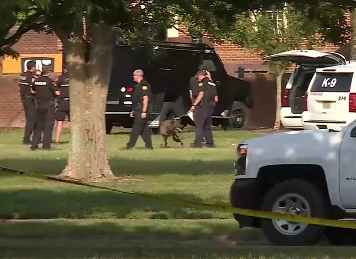 A police canine unit stands by in this still image taken from video following a shooting incident at the municipal center in Virginia Beach, Virginia (Photo Reuters)
