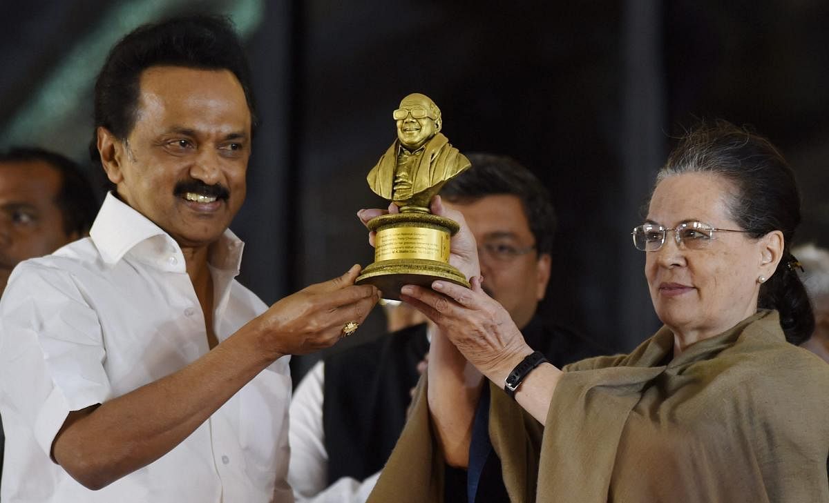 Former Congress President Sonia Gandhi is being presented a memento by DMK president MK Stalin at a public meeting after unveiling a life-size bronze statue of late Chief Minister and DMK President M Karunanidhi at YMCA ground in Chennai, on Sunday, Dec. 16, 2018. (PTI Photo)