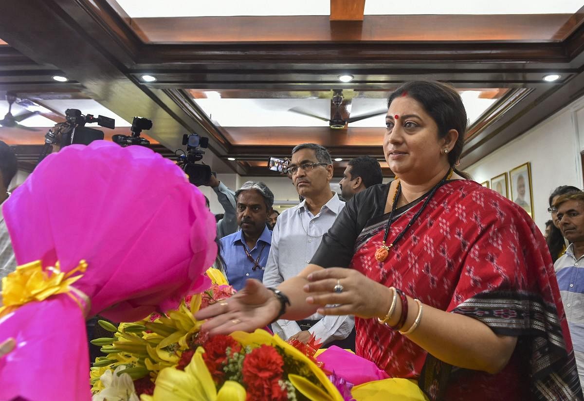 Smriti Irani is greeted as she takes charge as Minister of Women and Child Development at her office, in New Delhi, Monday, June 03, 2019. (PTI Photo)