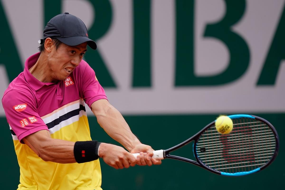 GUTSY: Japan's Kei Nishikori returns during his hard-fought win over France's Benoit Paire on Monday. AFP