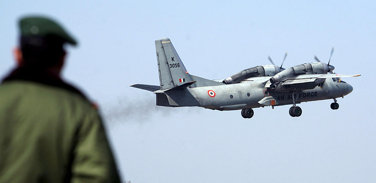 A soldier stands guard as an Indian Air Force AN-32 transport aircraft carrying security personnel takes-off. Reuters file photo