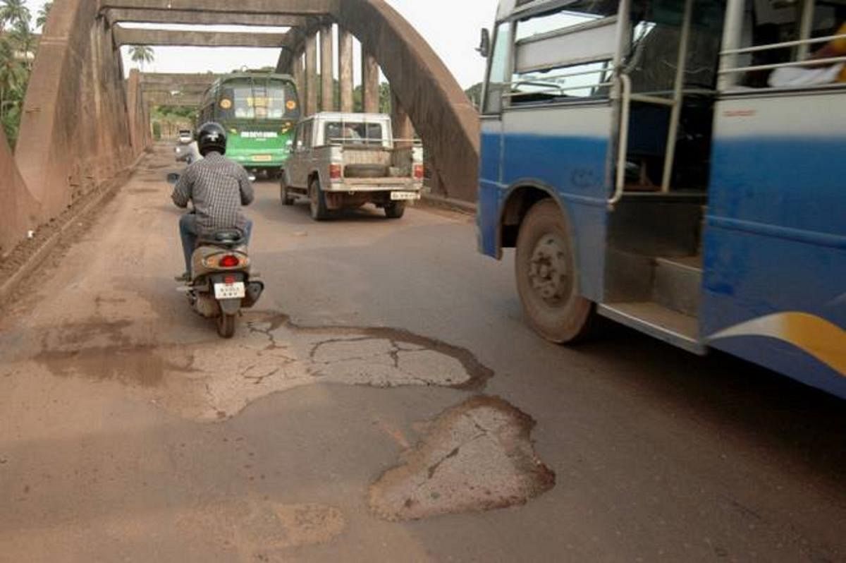 The condition of the road on the bridge.