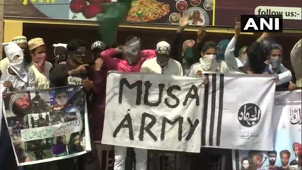 Stone pelting protesters with Pakistani and ISIS flags clashed with security forces in several parts of Kashmir Valley post-Eid-ul-Fitr prayers on Wednesday. ANI photo