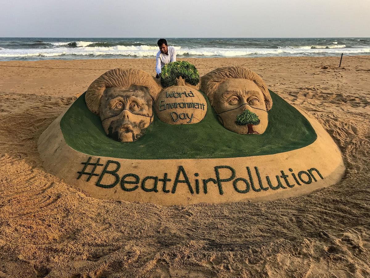 A view of a sand sculpture by sand artist Sudarsan Pattnaik on the eve of World Environment Day with a message 'Beat Air Pollution', at Puri beach, Odisha, Tuesday. PTI photo
