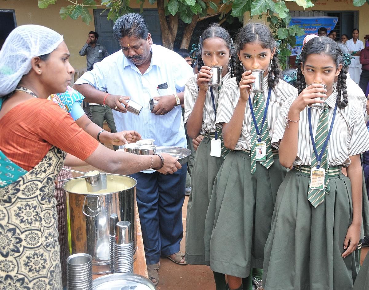 Students of Government School drink Milk during the launch of Ksheera Bhagya Scheme at Tandavapura in Nanjanagud taluk on Thursday.