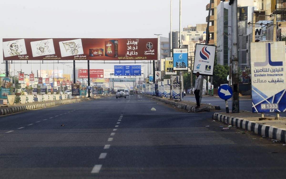A Sudanese man stands on the pavement in a nearly deserted avenue in the capital Khartoum on June 4, 2019. (AFP)